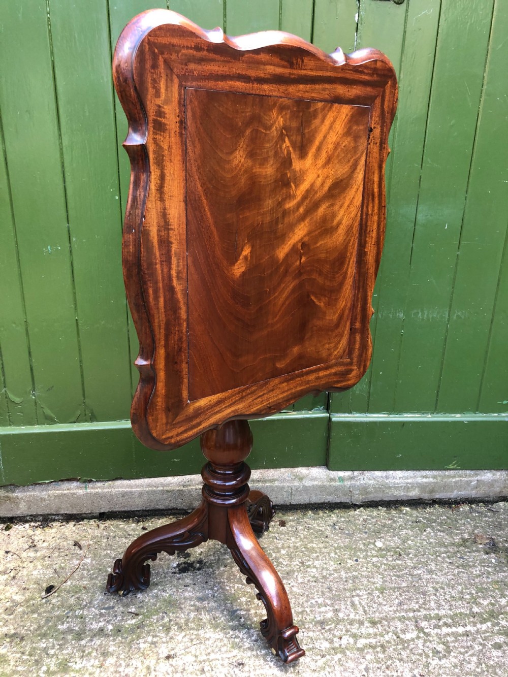 Mid C19th mahogany table with shaped top on carved tripod base in the manner of Gillows of Lancaster. View XIV