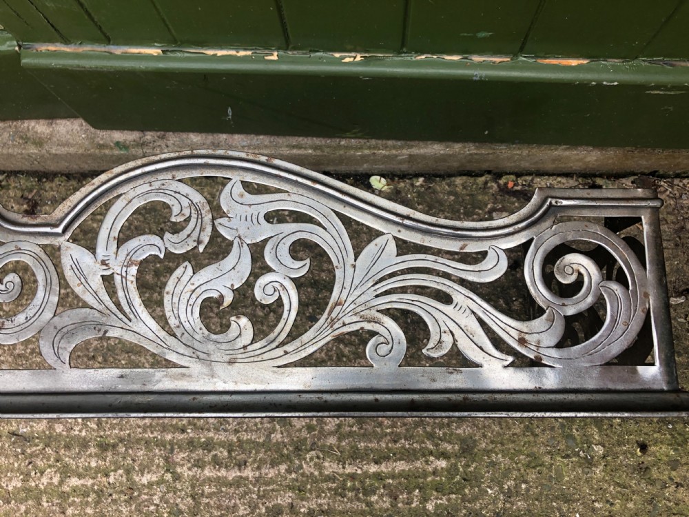 Highly decorative C19th cut-steel fire-place guard or fender in the mid C18th Georgian period revival style . View V