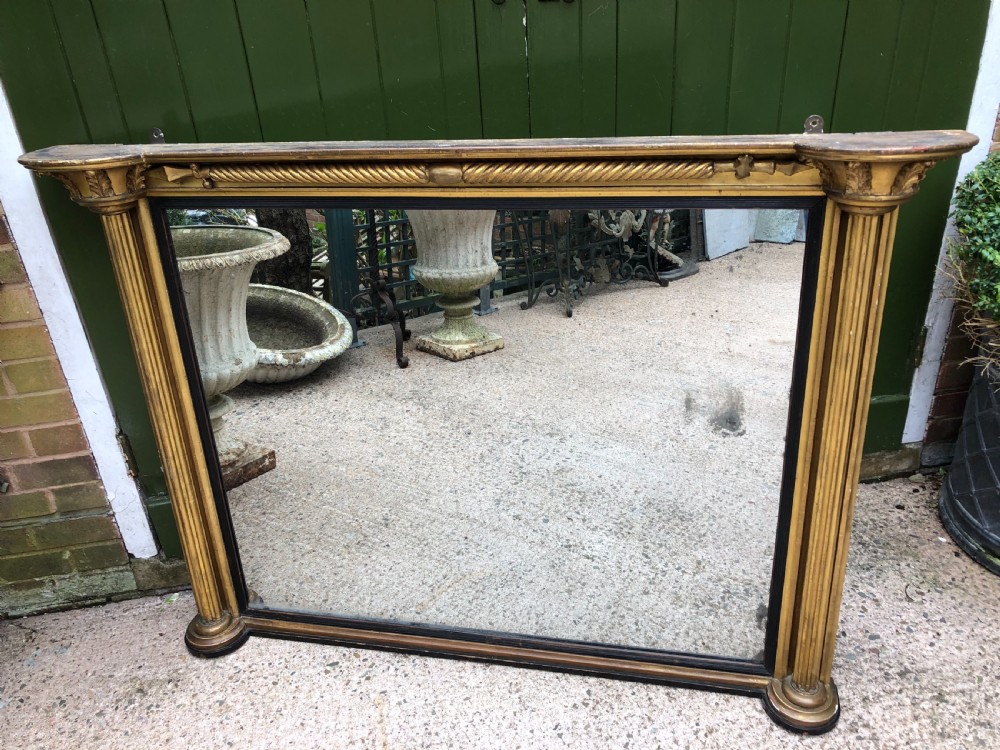 Early C19th Regency period carved giltwood overmantel mirror of practical scale and proportions. View III
