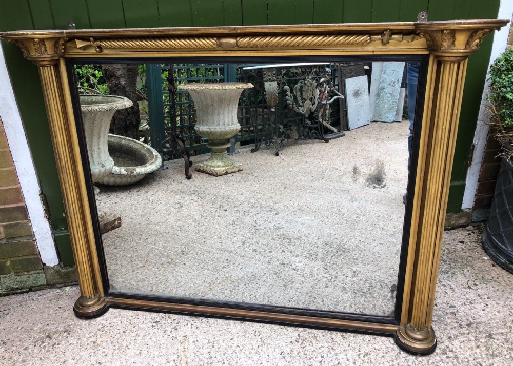 Early C19th Regency period carved giltwood overmantel mirror of practical scale and proportions. View VI