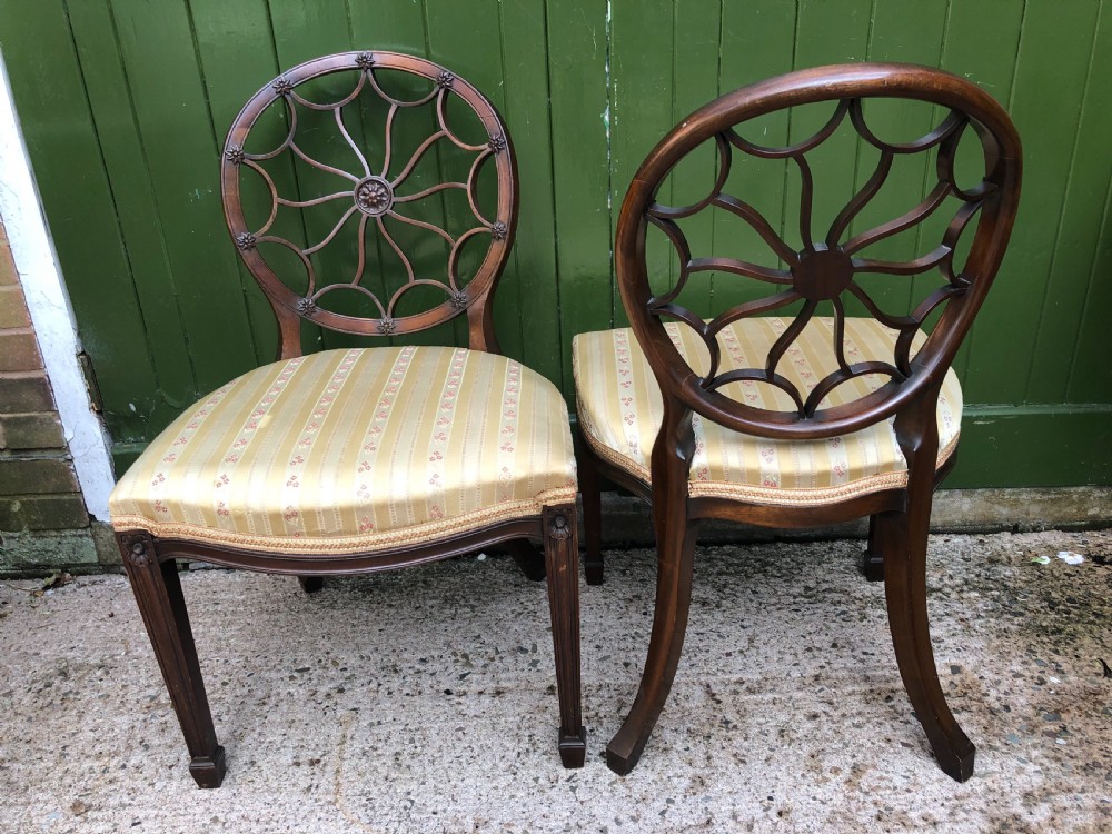 Pair of early C20th mahogany side chairs of C18th George III period design . View VI