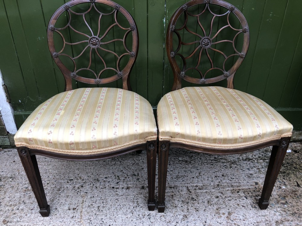 Pair of early C20th mahogany side chairs of C18th George III period design .