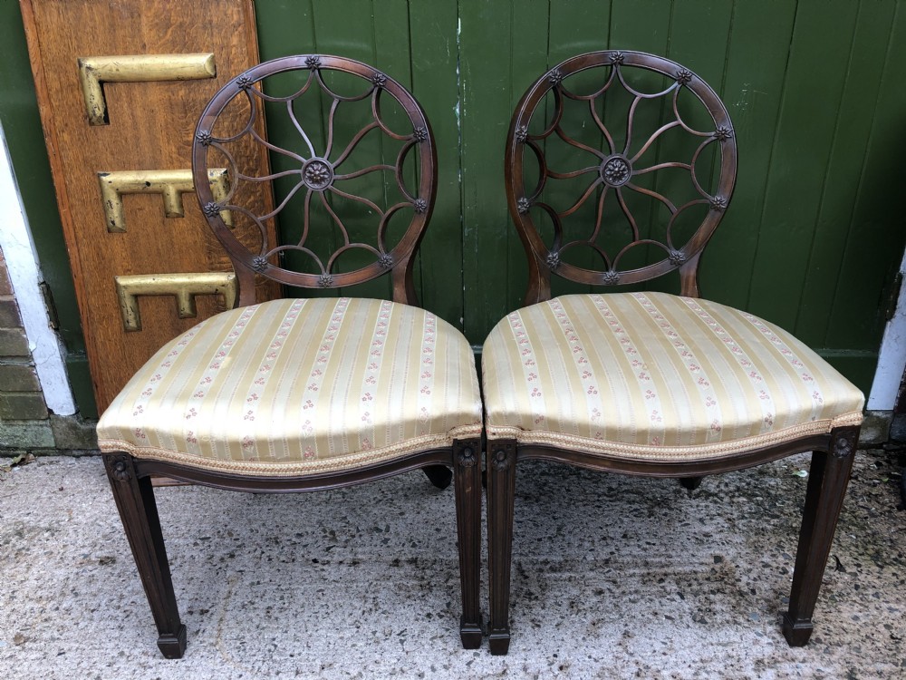 Pair of early C20th mahogany side chairs of C18th George III period design . View II