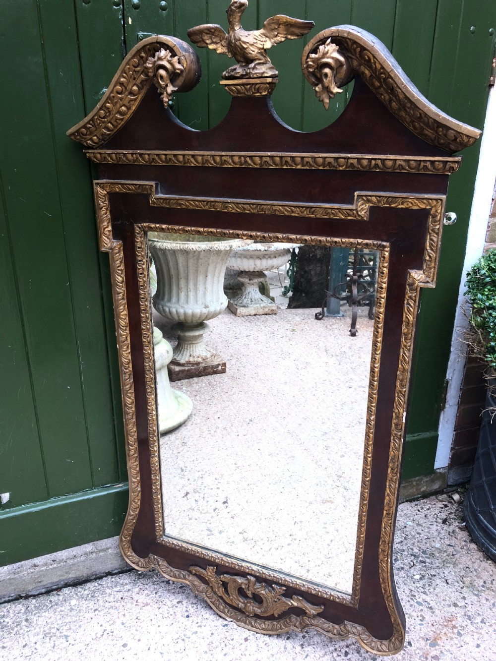 C19th George II period revival walnut and parcel-gilt framed mirror of impressive proportions. View VII