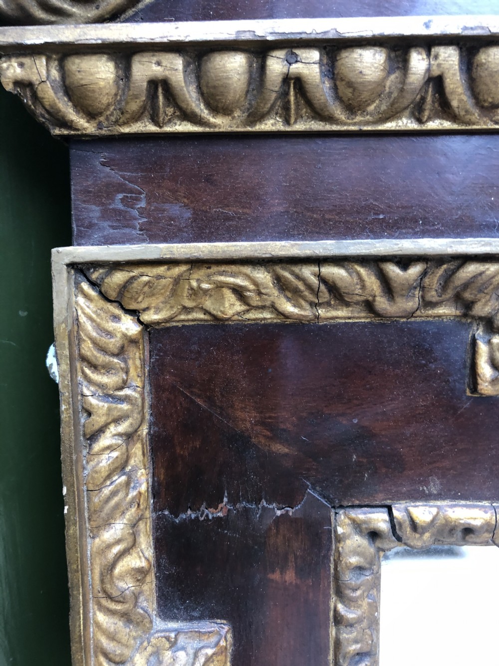C19th George II period revival walnut and parcel-gilt framed mirror of impressive proportions. View XVI