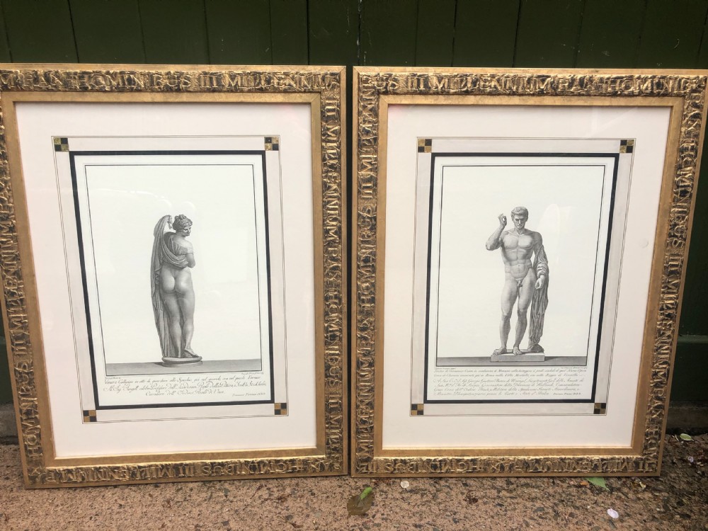 A pair of framed late 18th-century Neoclassical engravings depicting classical Greco-Roman statues in gilded wooden frames. View X