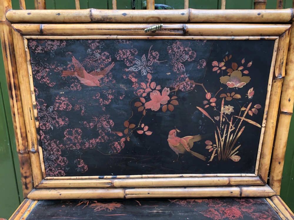A late 19th-century bamboo escritoire cabinet featuring a pagoda-shaped top finial, a lacquered drop-front writing slope, side shelves, and a lower lacquered cupboard door decorated with floral motifs. View III