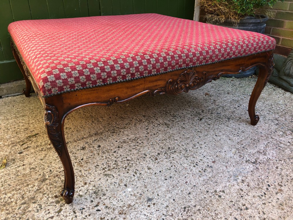 Large early C20th carved walnut-framed upholstered stool of mid C19th design. View II