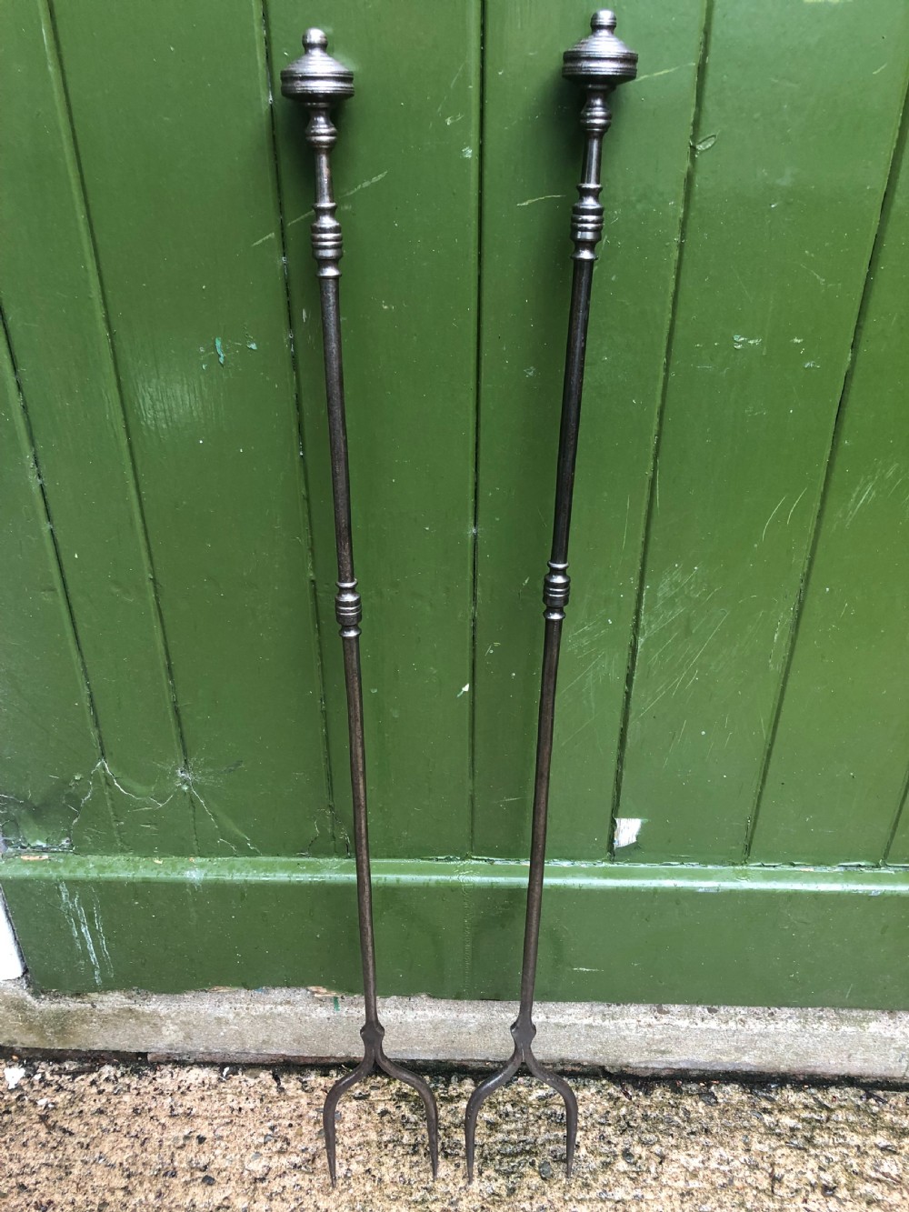 Rare pair of late C18th George III period ‘country-house’ steel fire-place log forks .