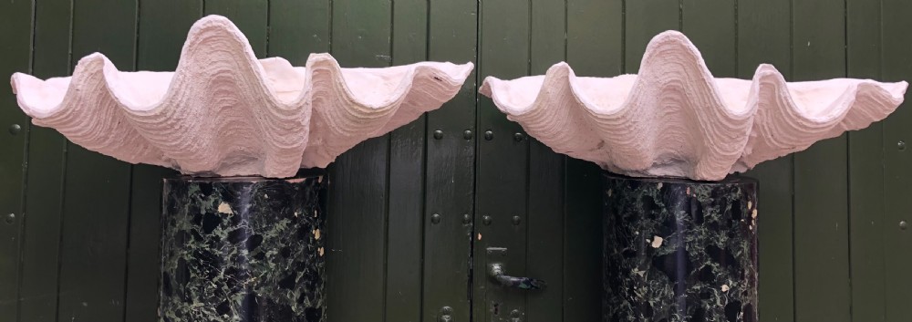A pair of large off-white composition giant clam shells featuring deep wavy scalloped edges and textured exterior growth ridges. View XII