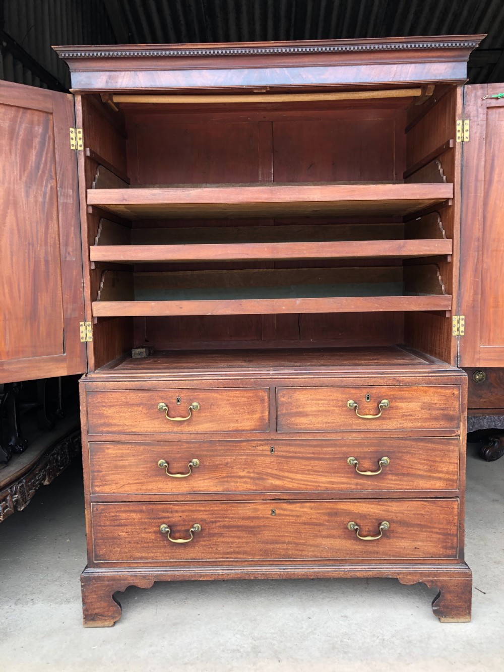 Late C18th George III period mahogany linen-press of small proportions. View II