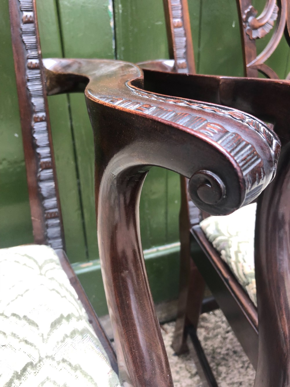 A set of eight carved mahogany Chippendale style dining chairs with decorative pierced back splats and patterned upholstered seats. View XIII