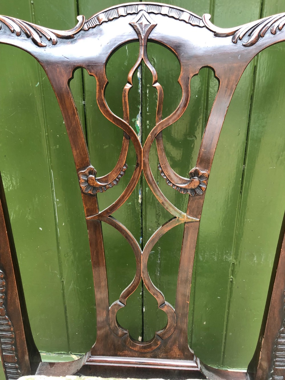 A set of eight carved mahogany Chippendale style dining chairs with decorative pierced back splats and patterned upholstered seats. View XXII