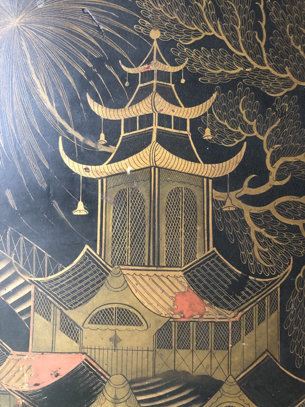 A rectangular black lacquered Regency papier-mache tray featuring gilded chinoiserie landscape decoration and two brass side handles. View VI