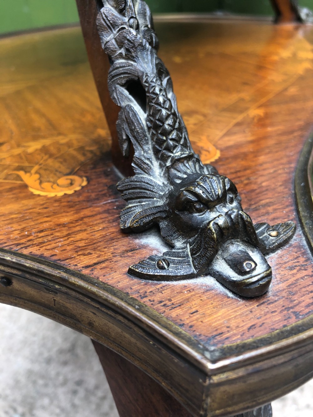 An early nineteenth-century French two-tier etagere table featuring detailed floral marquetry inlay, cabriole legs, brass galleries, and metal side handles. View XIII