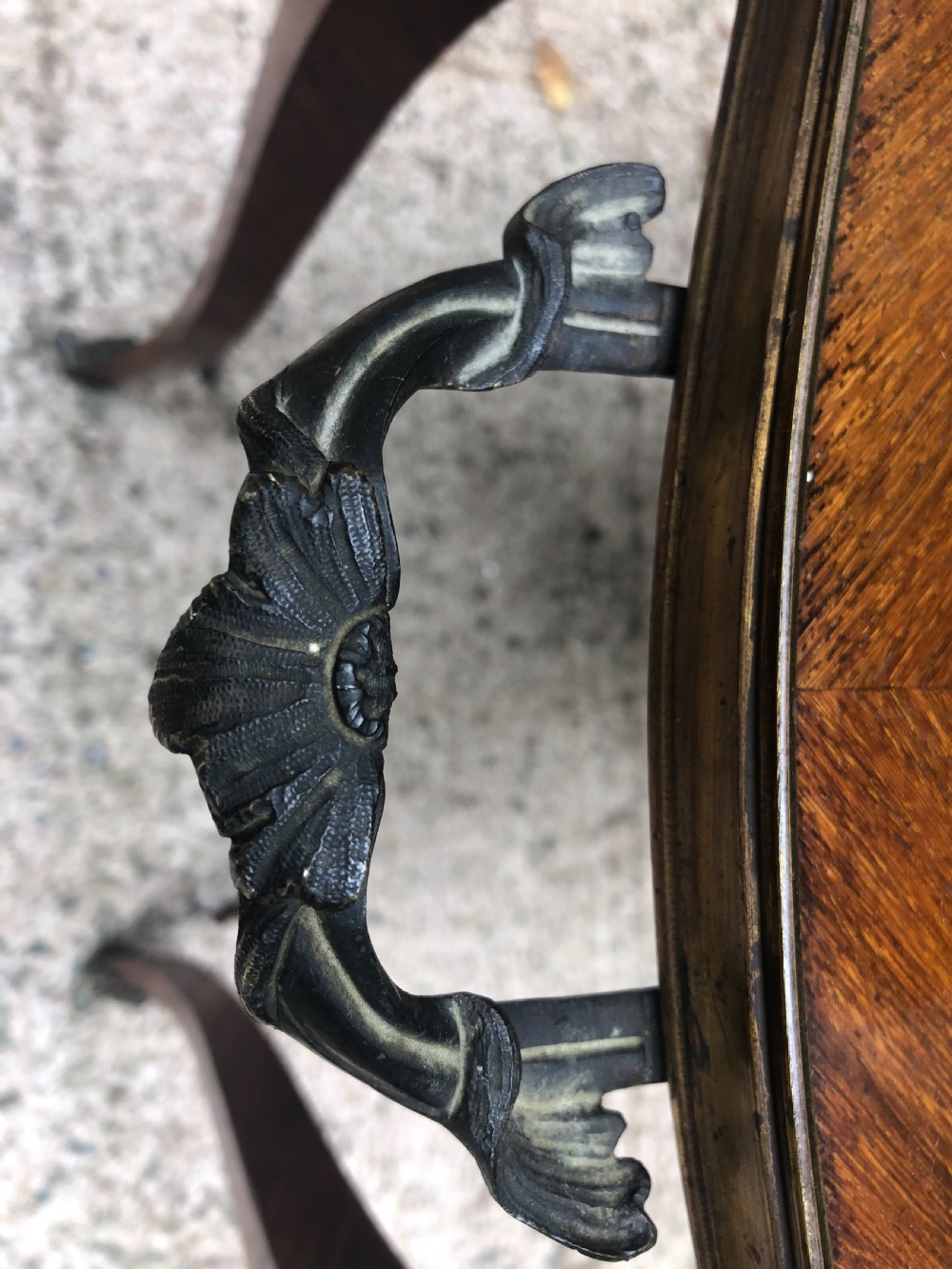 An early nineteenth-century French two-tier etagere table featuring detailed floral marquetry inlay, cabriole legs, brass galleries, and metal side handles. View XIV