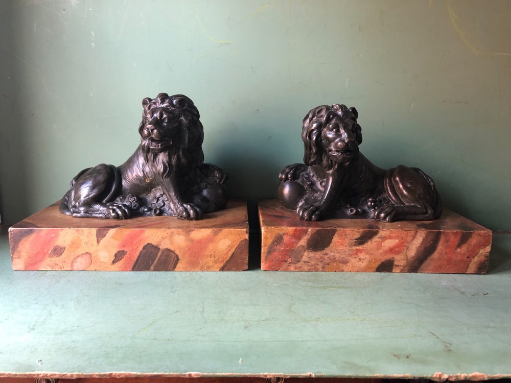Fine pair of C18th Italian bronze lions mounted on ‘faux’ marble decorated plinth bases . View II