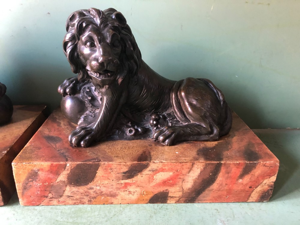 Fine pair of C18th Italian bronze lions mounted on ‘faux’ marble decorated plinth bases . View III