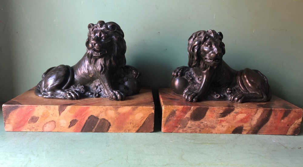 Fine pair of C18th Italian bronze lions mounted on ‘faux’ marble decorated plinth bases . View IV