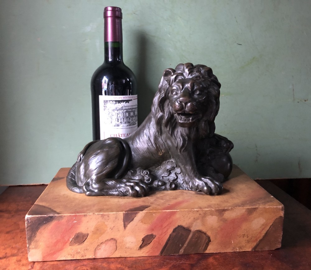 Fine pair of C18th Italian bronze lions mounted on ‘faux’ marble decorated plinth bases . View VI