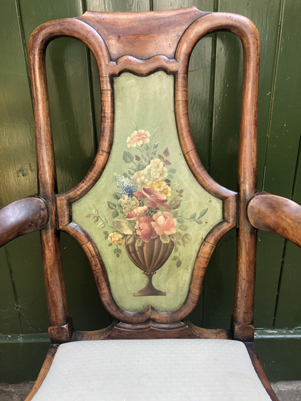 Early 20th-century Queen Anne revival walnut armchair featuring a painted floral splat back, carved armrests, cabriole legs, and cream upholstery. View IX