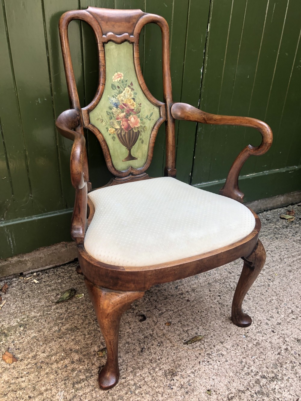 Early 20th-century Queen Anne revival walnut armchair featuring a painted floral splat back, carved armrests, cabriole legs, and cream upholstery. View XI