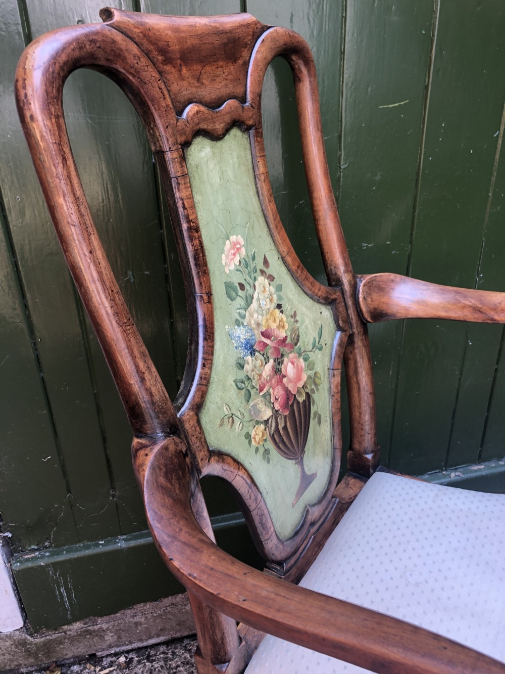 Early 20th-century Queen Anne revival walnut armchair featuring a painted floral splat back, carved armrests, cabriole legs, and cream upholstery. View XII
