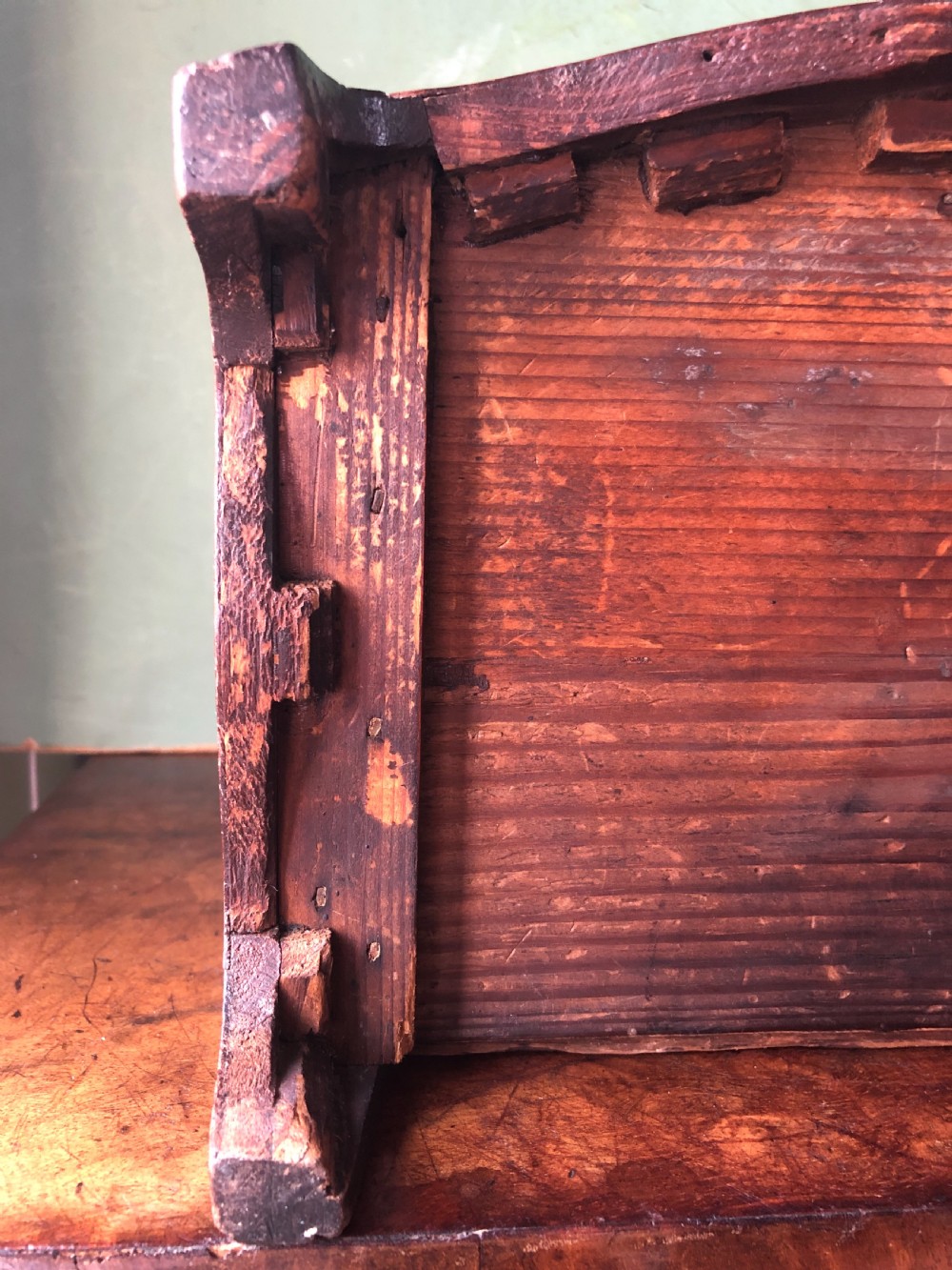 An early nineteenth-century miniature mahogany bow-front chest of drawers featuring brass ring handles and keyholes. View IX