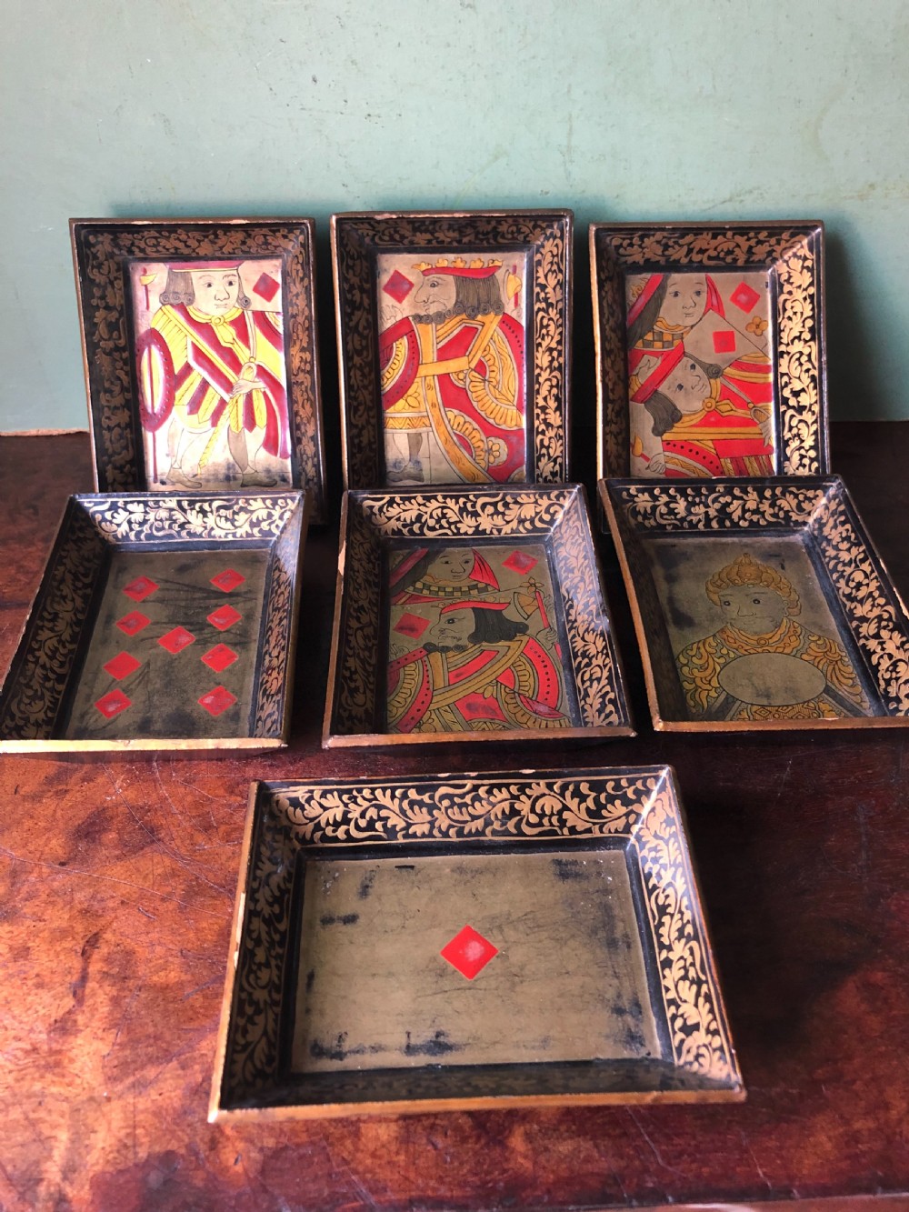 Interesting and decorative set of 7 mid C19th Chinese Export lacquer miniature trays for holding gambling chips .