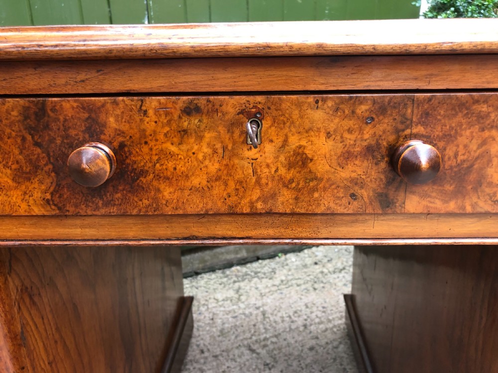 Good quality mid C19th burr and figured walnut pedestal knee-hole writing desk . View XVIII