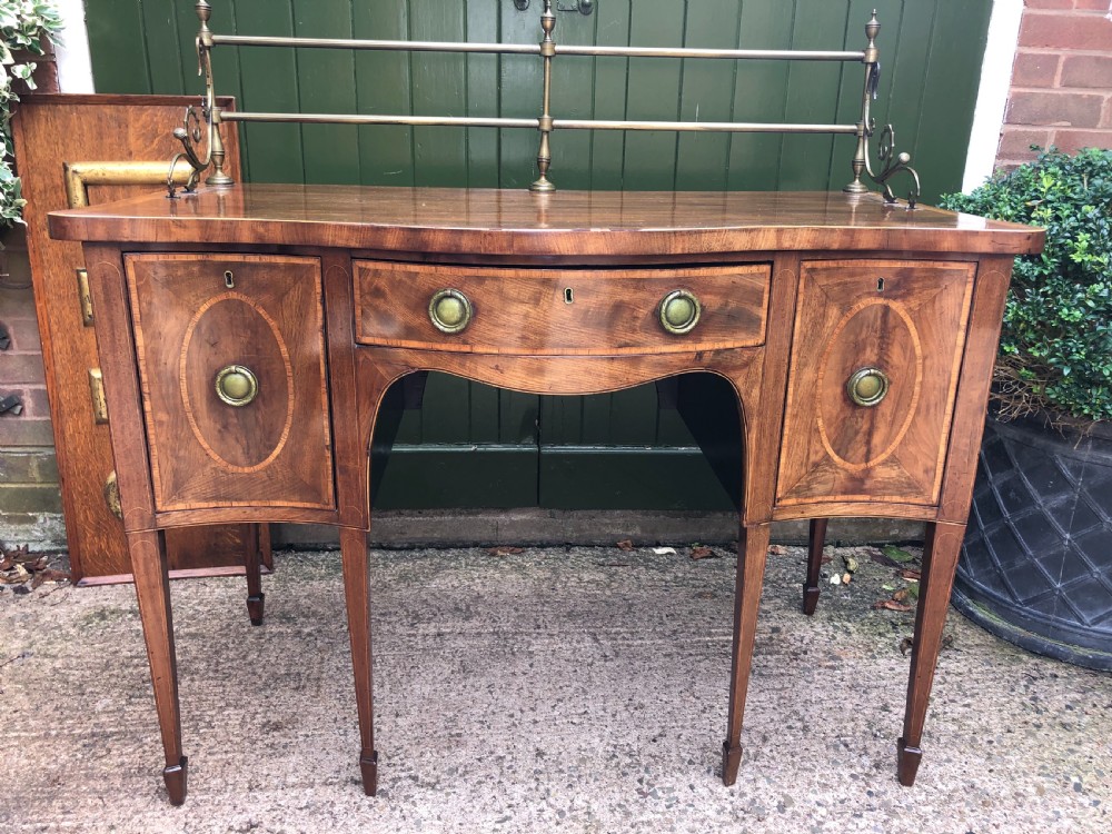 Fine late C18th George III Sheraton period mahogany serpentine front sideboard of compact proportions. View VII