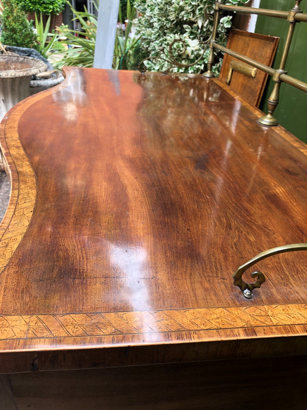 Fine late C18th George III Sheraton period mahogany serpentine front sideboard of compact proportions. View IX