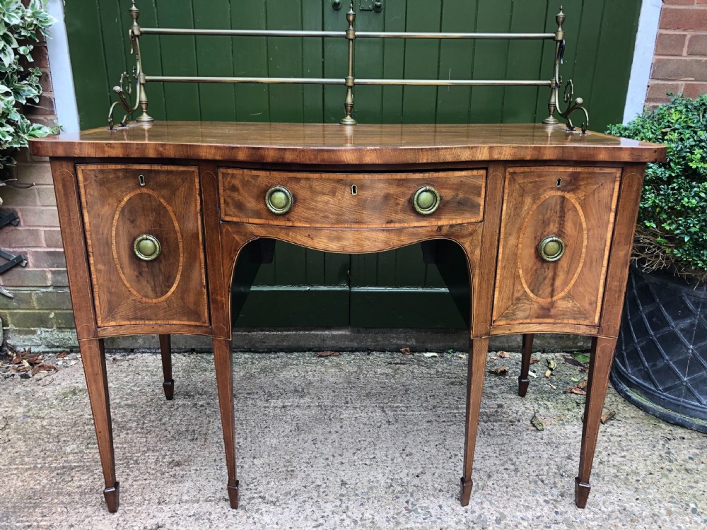 Fine late C18th George III Sheraton period mahogany serpentine front sideboard of compact proportions. View XIII