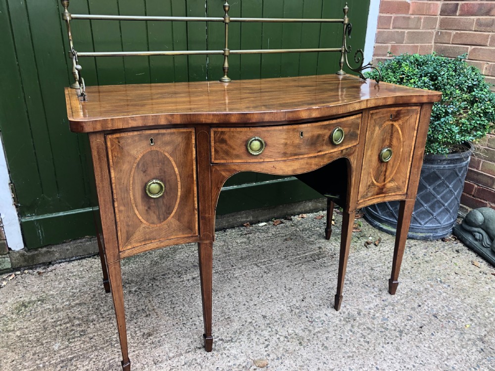 Fine late C18th George III Sheraton period mahogany serpentine front sideboard of compact proportions. View XIV