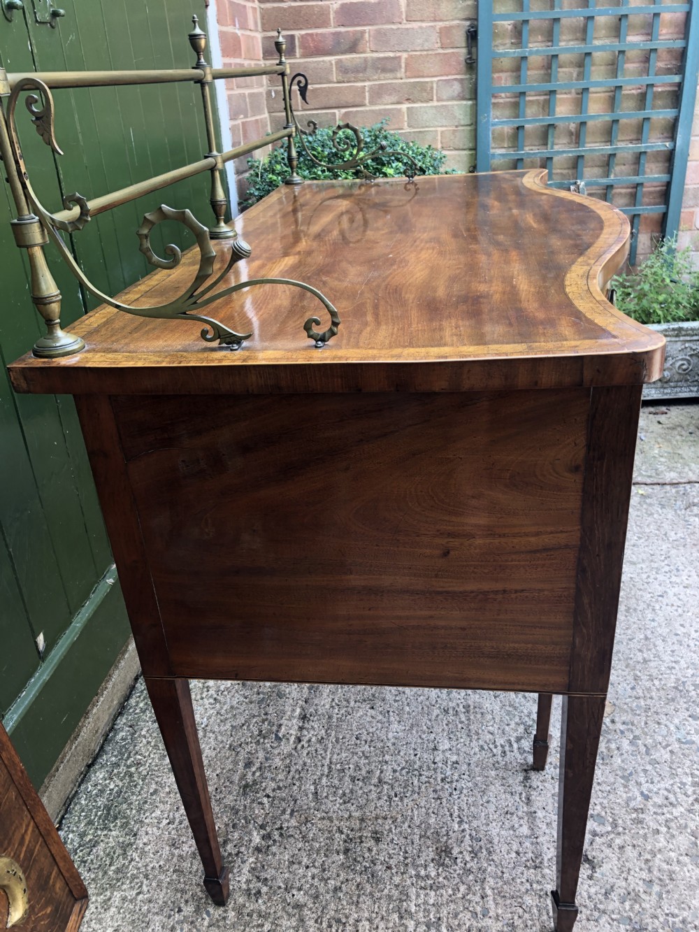 Fine late C18th George III Sheraton period mahogany serpentine front sideboard of compact proportions. View XVIII