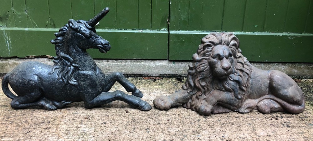 Pair of mid C19th cast-iron boot-scrapers in the form of a recumbent lion and a unicorn . 