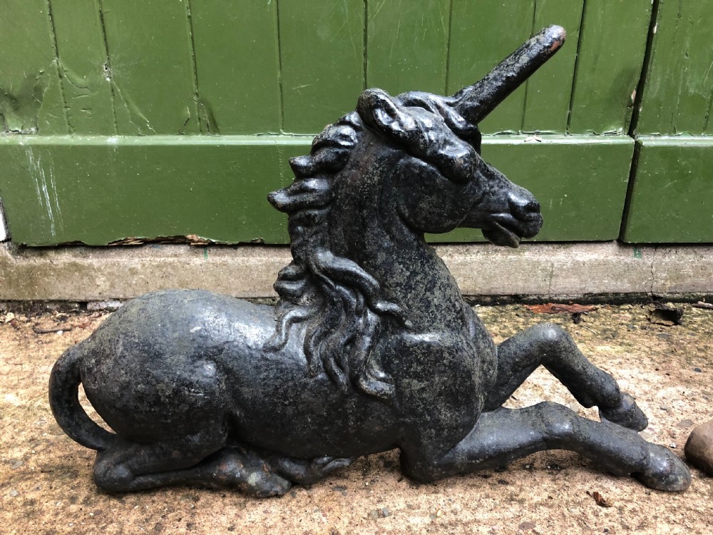 Pair of mid C19th cast-iron boot-scrapers in the form of a recumbent lion and a unicorn .  View III