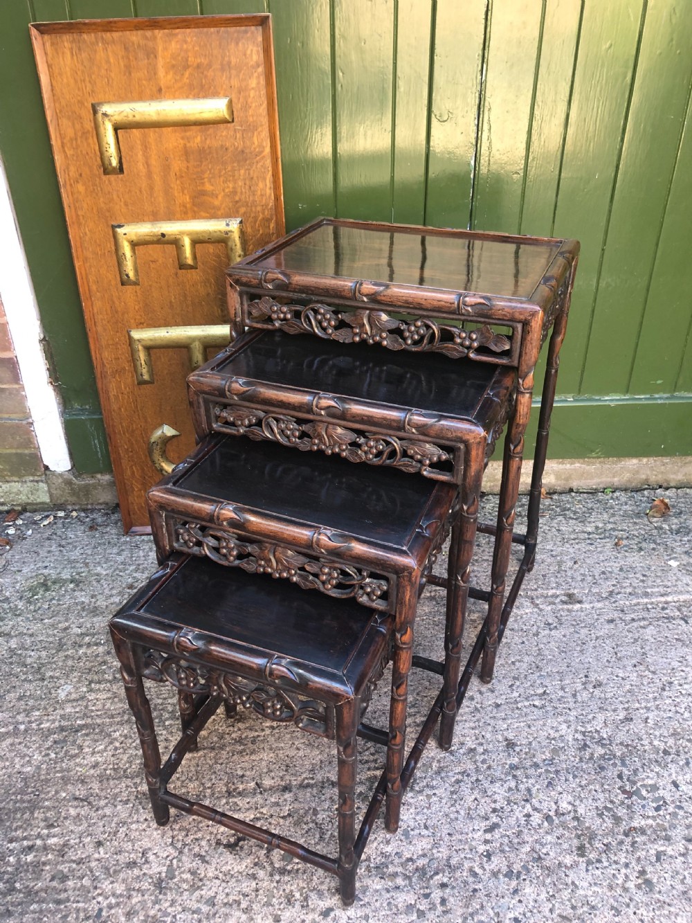 Nest of 4 late C19th Chinese Qing Dynasty carved hardwood graduated tables. View II