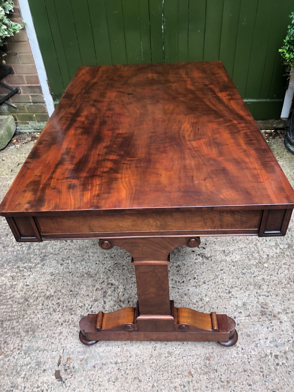 Early C19th George IV period mahogany library or writing table of free-standing form . View XXVI