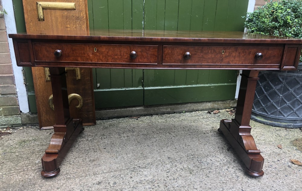 Early C19th George IV period mahogany library or writing table of free-standing form .