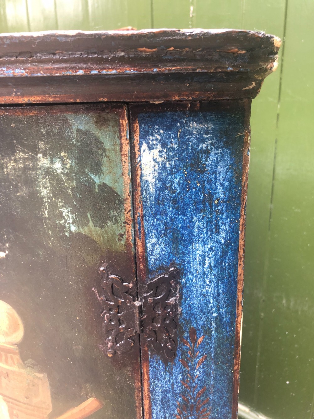 C18th Dutch bow-front hanging corner cupboard decorated with an exotic figural scene. View IV