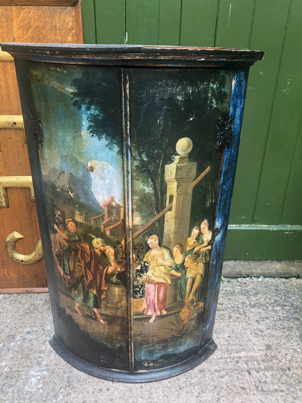 C18th Dutch bow-front hanging corner cupboard decorated with an exotic figural scene. View VII