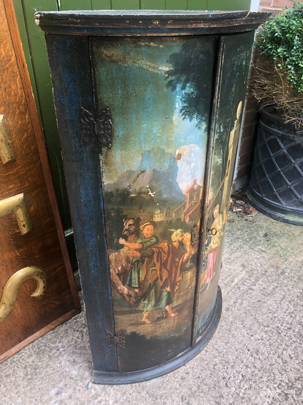 C18th Dutch bow-front hanging corner cupboard decorated with an exotic figural scene. View VIII