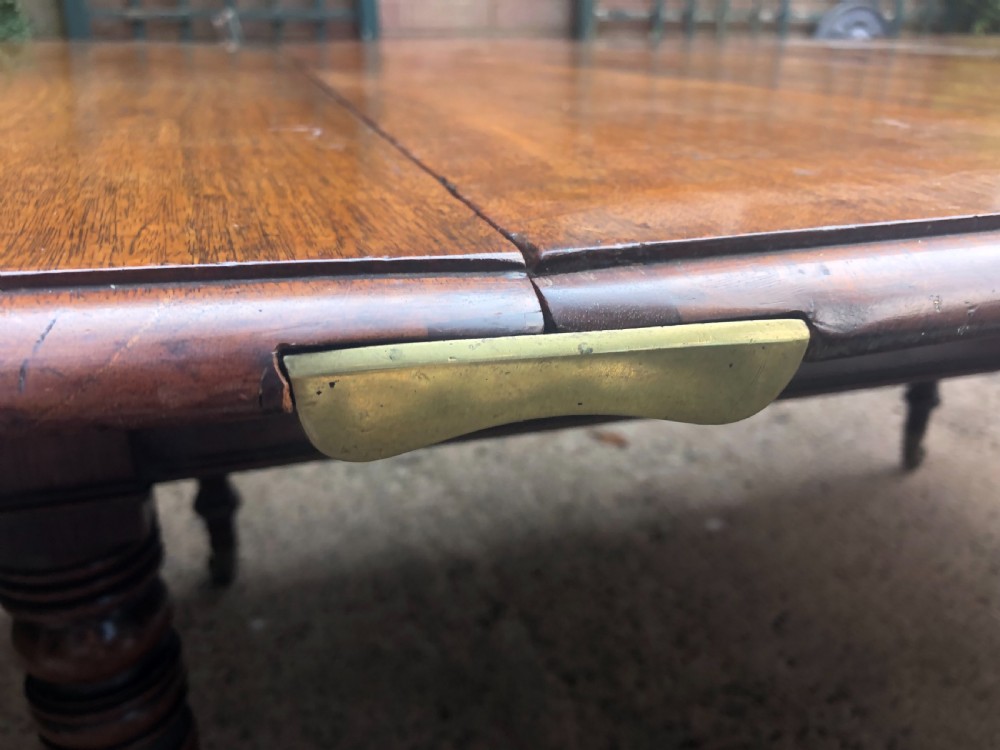 Elegant early C19th Regency period  mahogany extending dining table of unusual design and format. View VIII