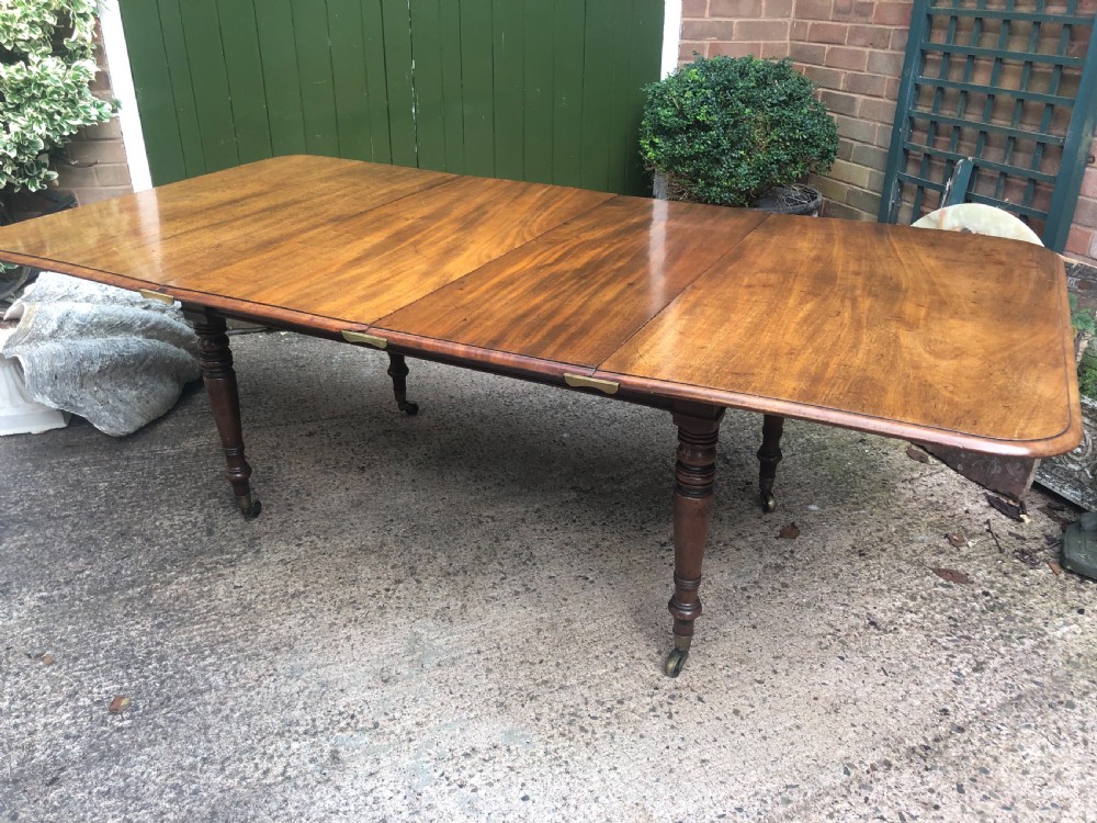 Elegant early C19th Regency period  mahogany extending dining table of unusual design and format. View IX