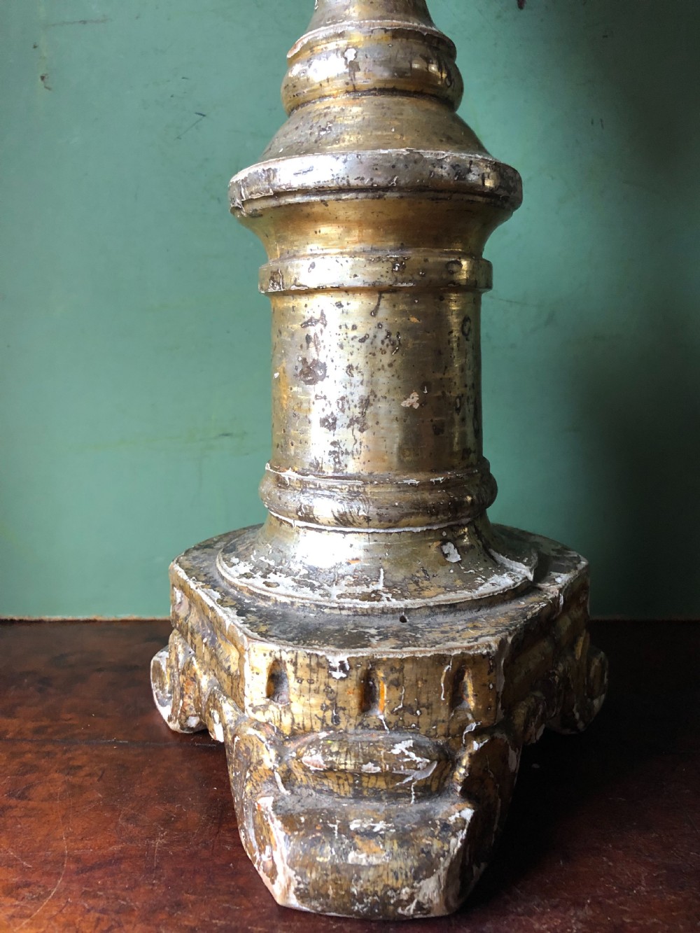 A pair of tall late eighteenth-century Italian carved giltwood altar candlesticks with turned baluster stems and mecca finish. View VI