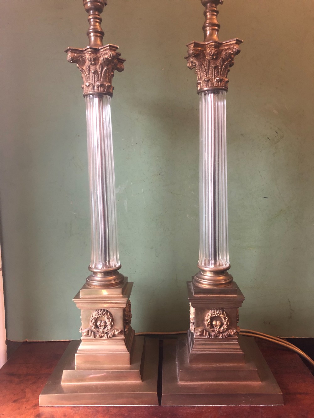 Pair of early C20th gilt-brass and glass corinthian column table lamps 