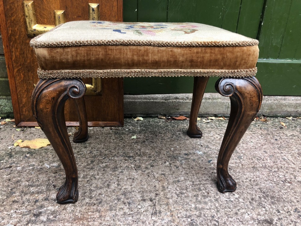 Early C20th George I period revival cabriole leg rectangular walnut stool with embroidered tapestry covered seat .