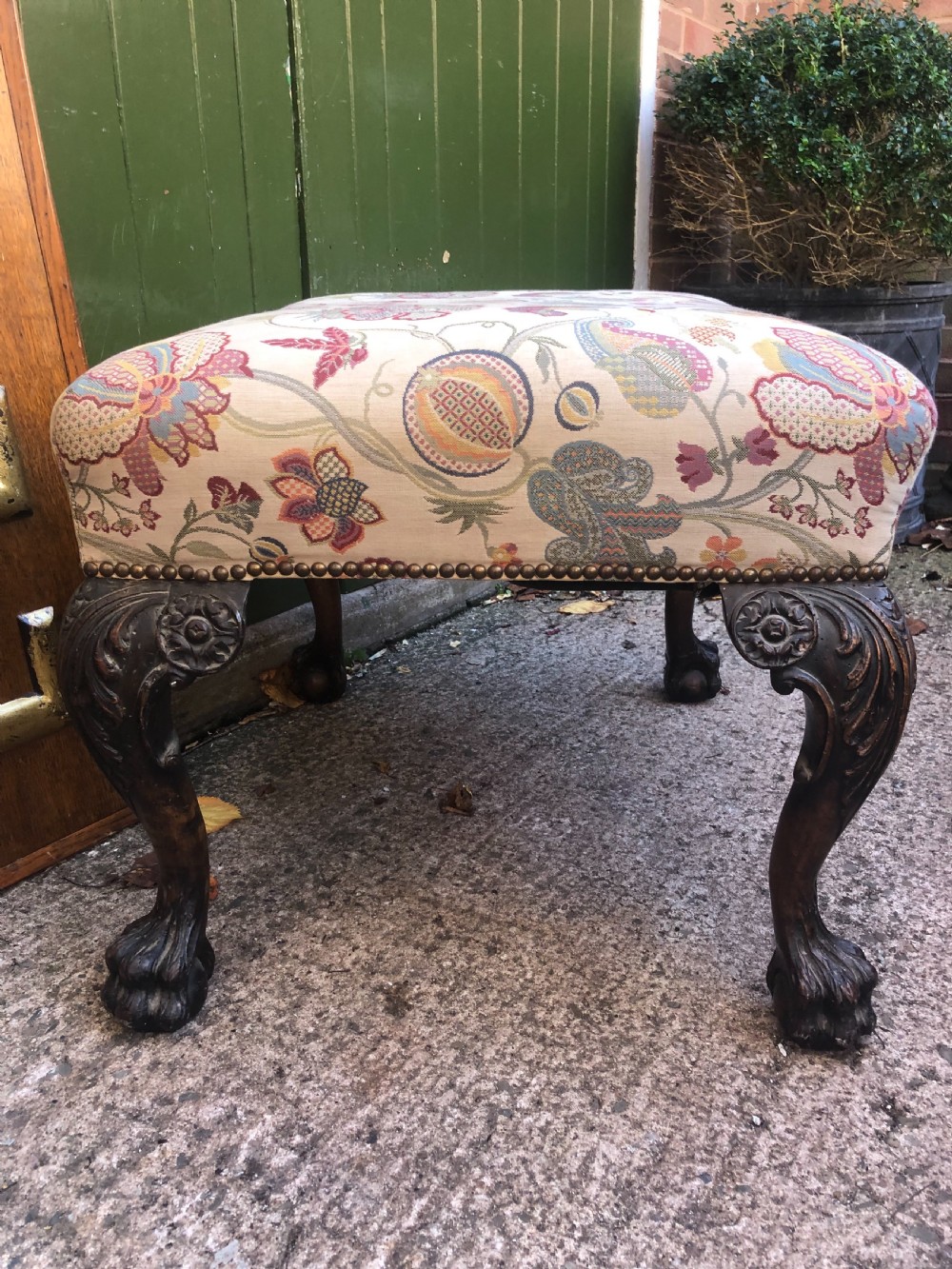 A rectangular floral upholstered stool featuring dark carved walnut cabriole legs with floral knees and claw-and-ball feet. View VIII