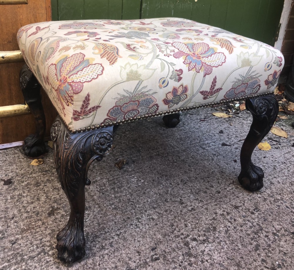 A rectangular floral upholstered stool featuring dark carved walnut cabriole legs with floral knees and claw-and-ball feet. View XII